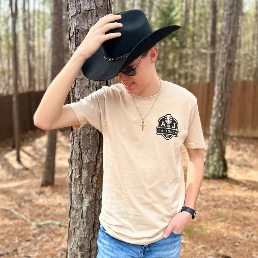 Sand colored AJ Robinson crest t-shirt