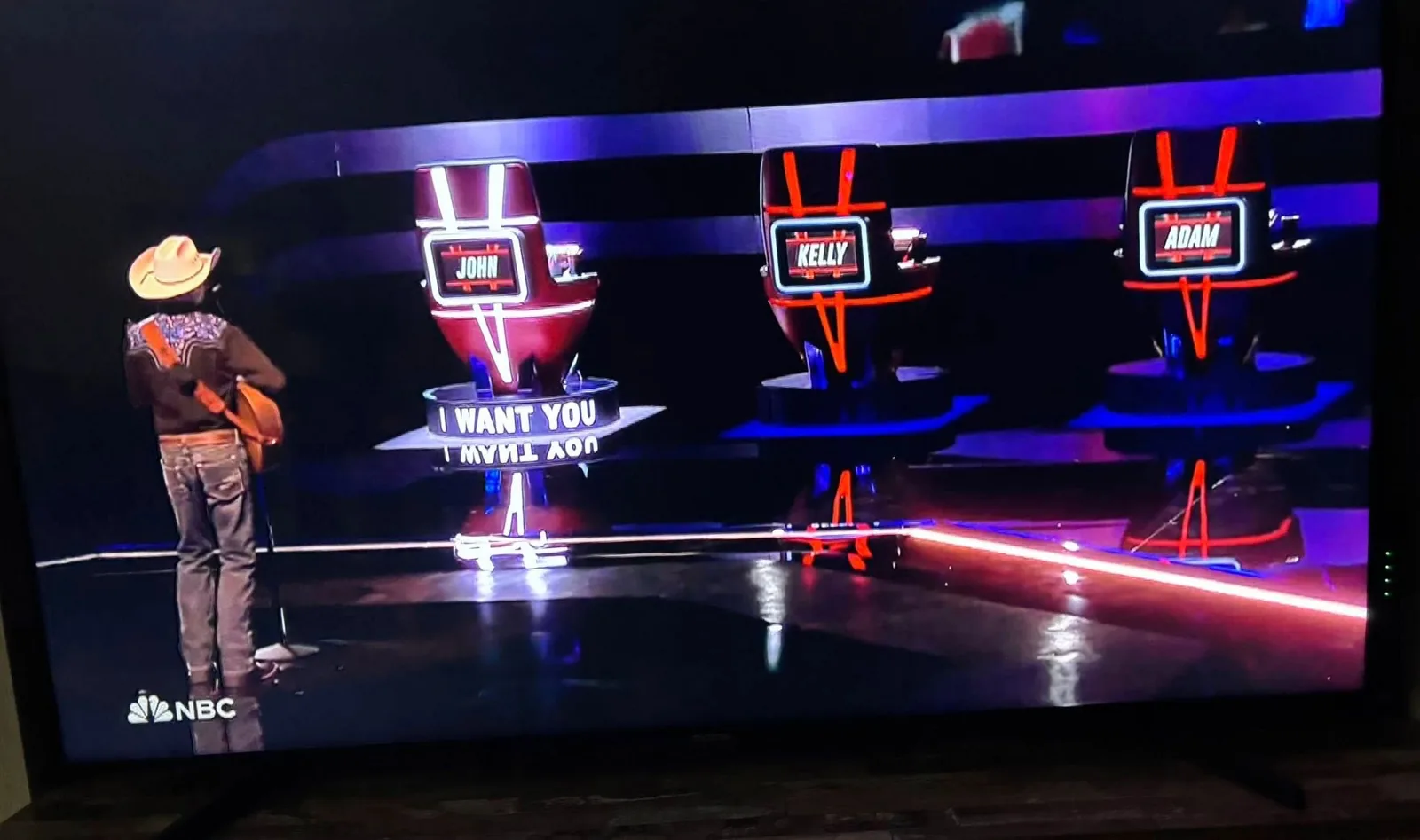 John Legend's chair turned toward AJ on The Voice, I Want You lit on the platform